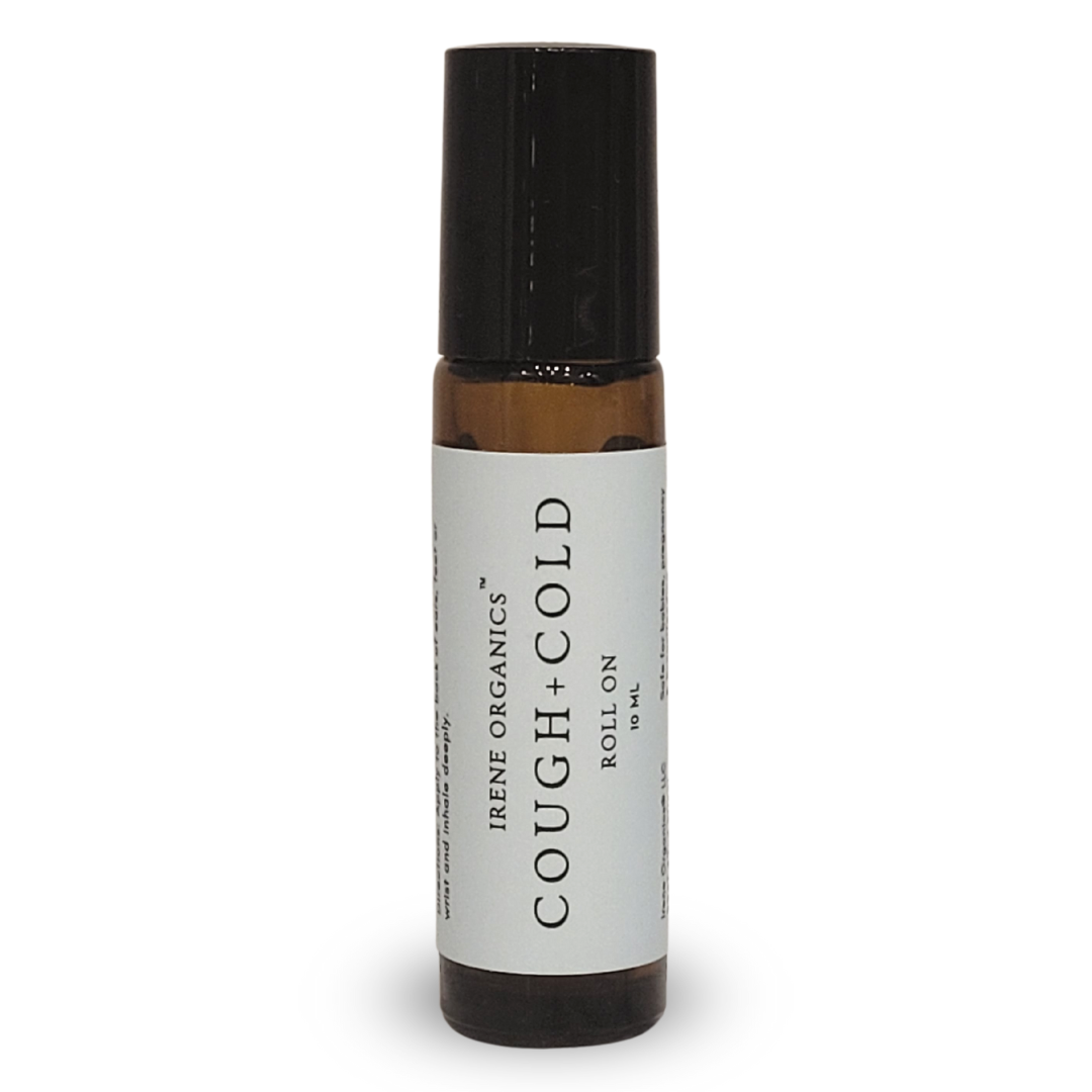 Irene Organics' Cough + Cold roll-on remedy sits isolated on a white surface.
