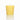 A natural beeswax votive candle sits on a reflective white surface.
