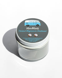 VanMan's Coconut Magnesium Deodorant jar shows a blue vintage van and lists its natural ingredients.

