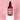 VanMan's Protection Oils bottle with coconut, almond, and olive blend sits on a white cube.
