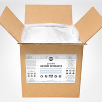 Open box displays unscented, hypoallergenic Rustic Strength laundry detergent powder promising powerful, earth-derived cleaning.
