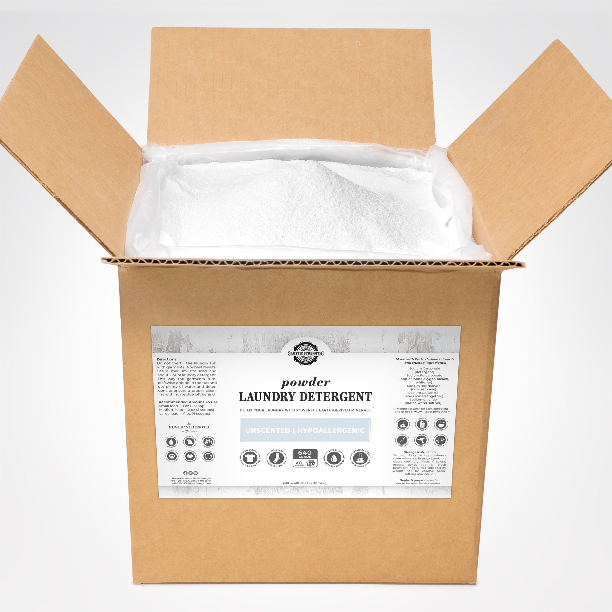 Open box displays unscented, hypoallergenic Rustic Strength laundry detergent powder promising powerful, earth-derived cleaning.
