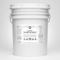 See a large bucket of Rustic Strength powder laundry detergent, unscented and hypoallergenic, offering 640 loads of earth-derived cleaning power.
