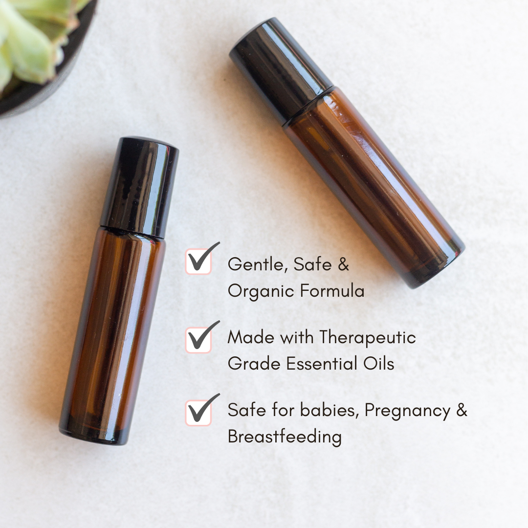 Two amber glass roller bottles containing organic essential oils offer a gentle and safe formula for babies, pregnancy, and breastfeeding.
