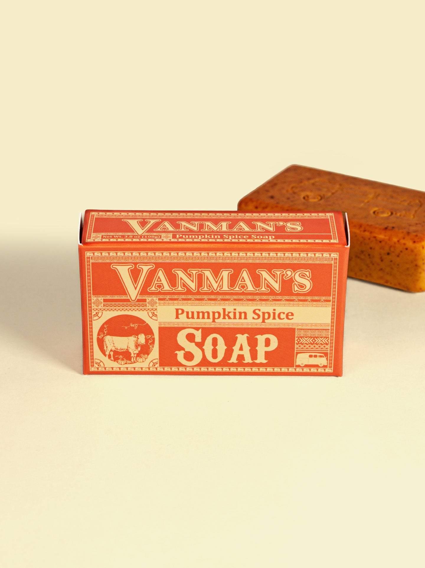 Showcases a Vanman's Pumpkin Spice Soap box with a bar of the soap behind it.
