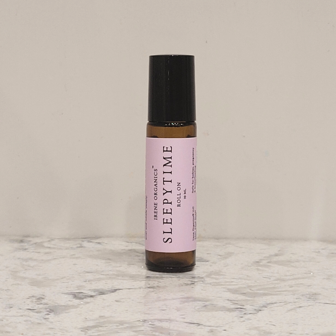 Irene Organics Sleepytime roll-on sits on a marble surface.
