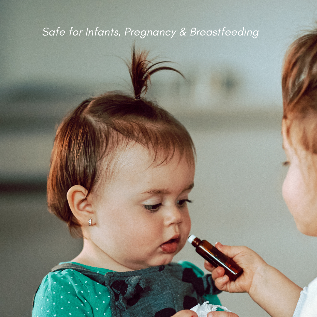 A young child receives natural essential oil remedy from another person, emphasizing safe use for infants.
