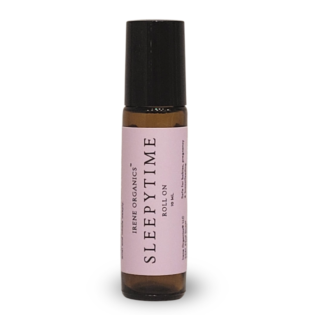 Irene Organics Sleepytime Roll-On, a 10 ml aromatherapy blend for babies, pregnancy, and breastfeeding, is displayed in a glass bottle with a black rollerball applicator.
