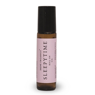 Irene Organics Sleepytime Roll-On, a 10 ml aromatherapy blend for babies, pregnancy, and breastfeeding, is displayed in a glass bottle with a black rollerball applicator.
