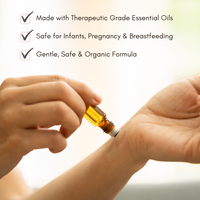 Applies therapeutic grade essential oil from a rollerball applicator to the wrist for aromatherapy.
