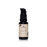 Annmarie Anti-Aging Facial Oil sits upright in a small black bottle with a pump dispenser.
