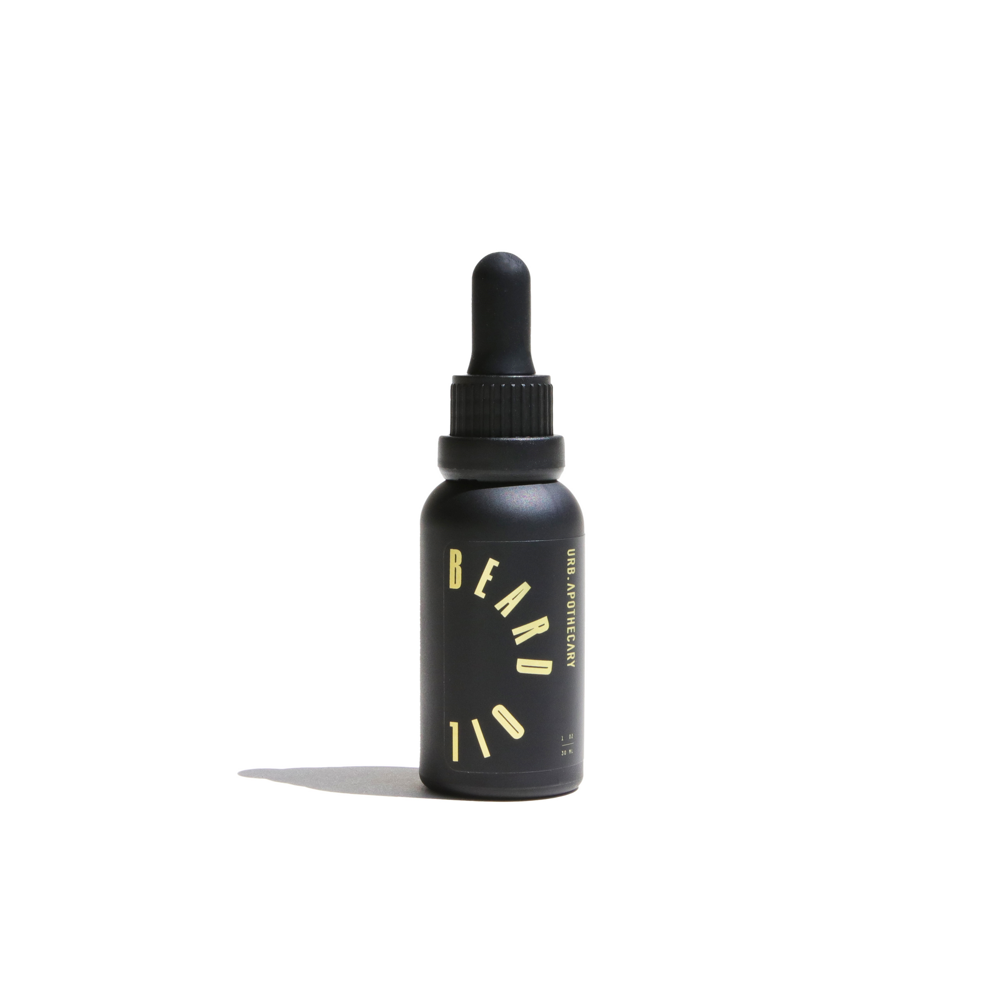 A sleek, black bottle showcases URB Apothecary beard oil with a dropper, promising grooming and care.
