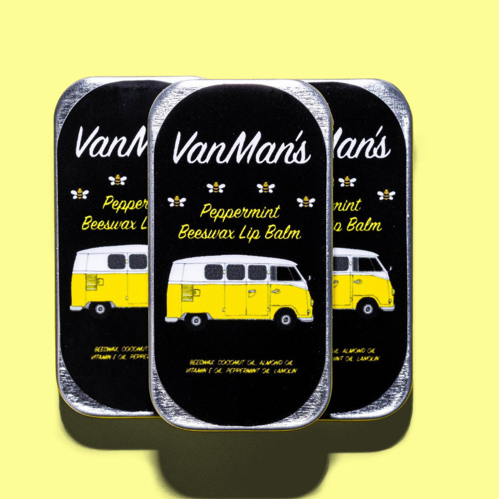 Three tins of VanMan's peppermint beeswax lip balm feature a yellow Volkswagen bus graphic and bee icons.
