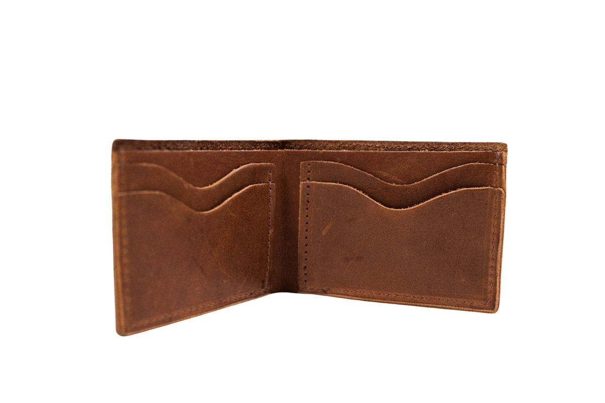 A new, open brown leather wallet displays its multiple card slots.
