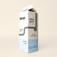 A carton of Bloop laundry soap promises a care-free, unscented, and sustainable cleaning experience.