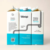 Bloop Laundry Soap cartons advertise their eco-friendly laundry detergent with all-natural ingredients and the Salt Air scent.
