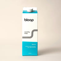 Bloop sells eco-friendly Salt Air laundry soap, a 32 oz carton with a refreshing mandarin orange, sea water, clary sage, and driftwood scent.
