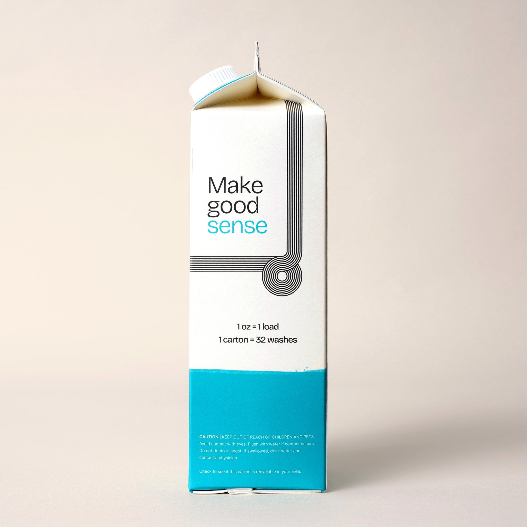 A laundry detergent carton displays "Make good sense" branding and states one carton equals 32 washes.
