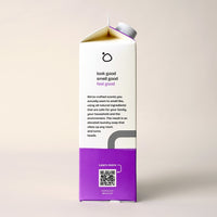 A carton of Bloop laundry soap highlights its all-natural, family-safe ingredients with a QR code for more information.
