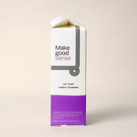 Examine a carton of eco-friendly "Make good sense" laundry detergent promising 32 washes per carton.