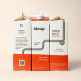 Three Bloop laundry soap cartons, featuring passionfruit and vanilla orchid scents, promise a pleasant, eco-friendly laundry experience.
