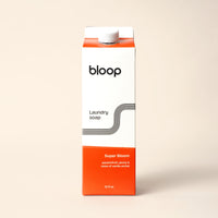 Bloop brand offers a 32 fl oz carton of Super Bloom laundry soap with passionfruit, peony, and vanilla orchid notes.
