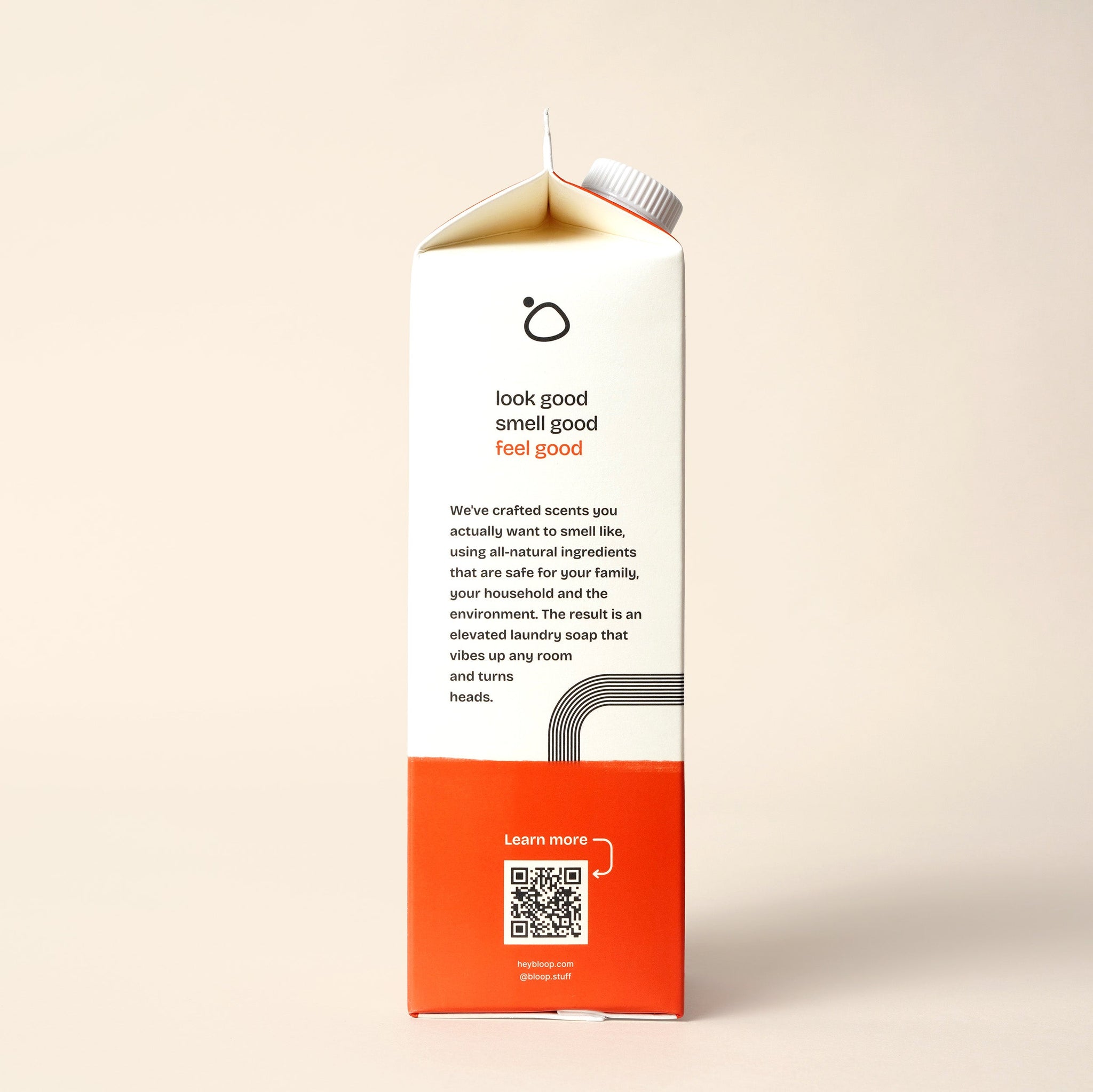 A laundry soap carton promotes its all-natural ingredients, appealing scents, and eco-friendly formula for family and household use.
