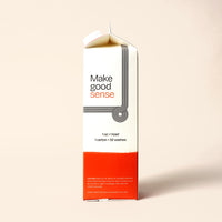 Upright laundry detergent carton features minimalist design and boasts 32 washes per carton.
