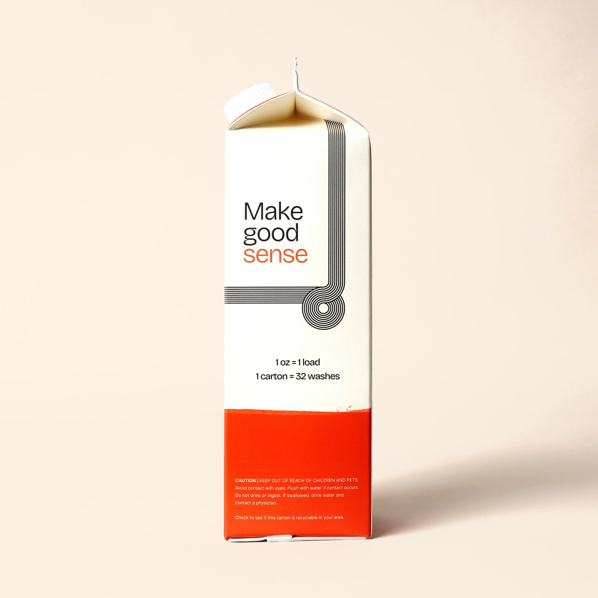 Upright laundry detergent carton features minimalist design and boasts 32 washes per carton.
