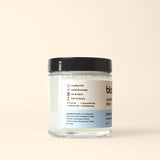 See a jar of Bloom Laundry Soap, a cruelty-free and eco-friendly product.