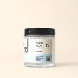 A jar of Bloop Group's "Make Good Sense" laundry detergent sits against a neutral background, promoting sustainable laundry practices.

