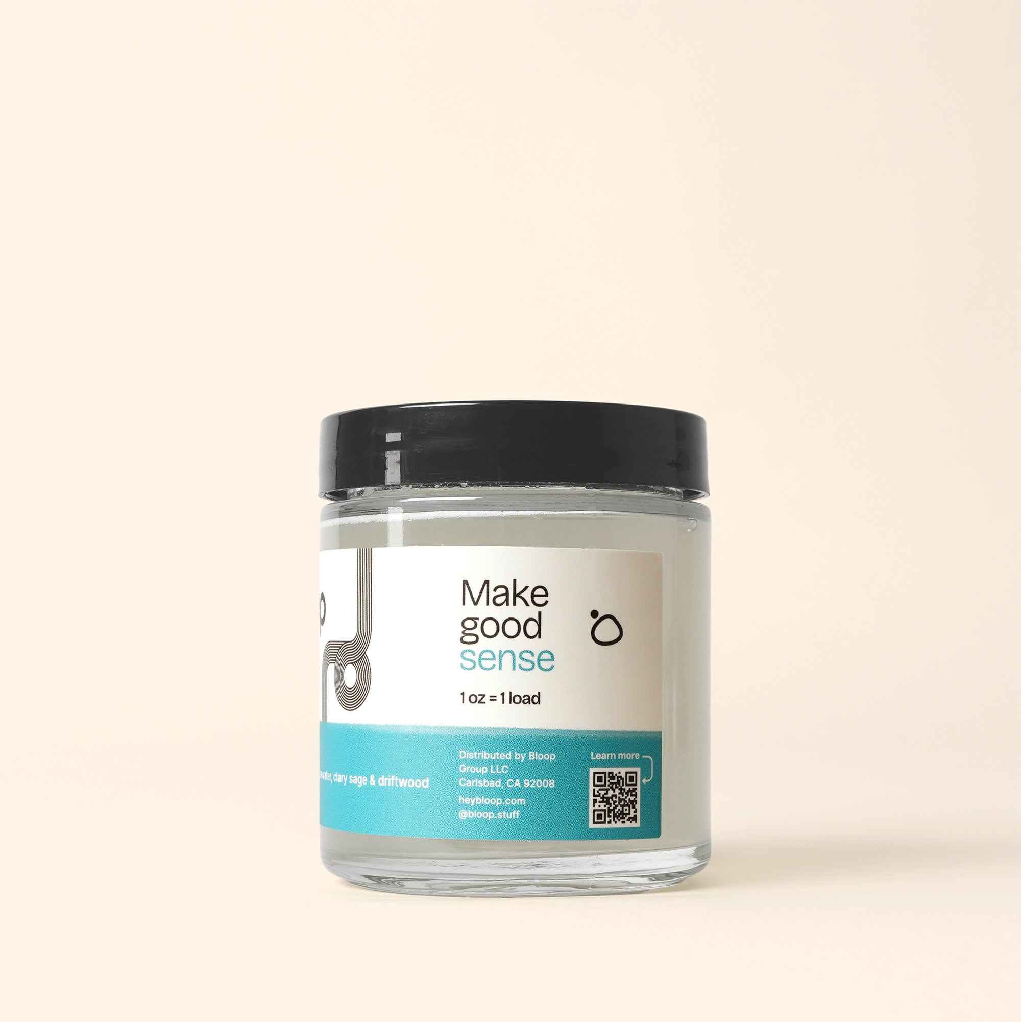 Close-up shows a "Make Good Sense" scented balm jar with a black lid, highlighting the brand's unique packaging and clean beauty formula.
