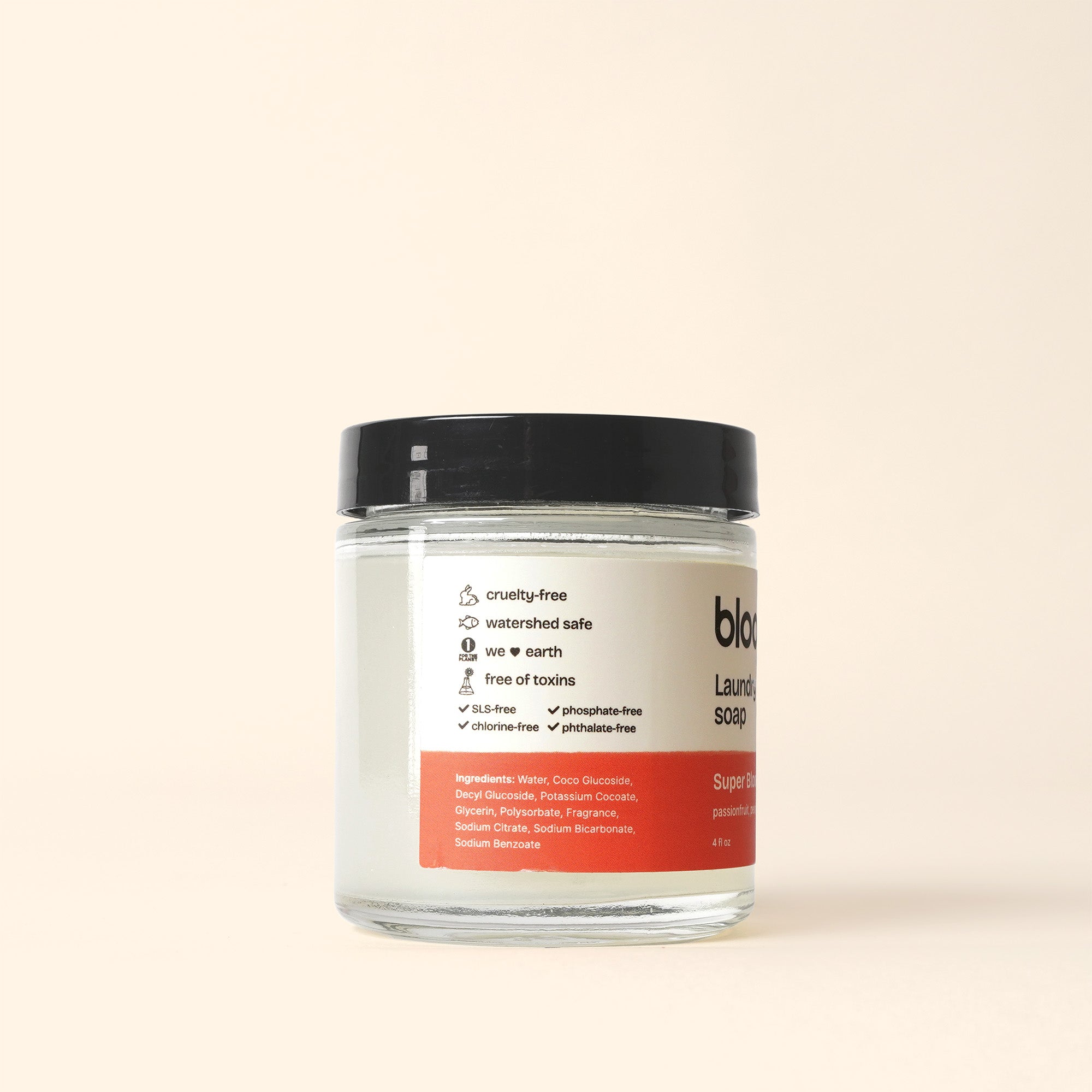 View a jar of Bloom Laundry Soap boasting cruelty-free and toxin-free ingredients for eco-friendly cleaning.
