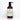 Rustic Strength's rosemary mint body wash bottle sits against a white tiled backdrop.