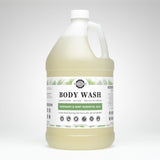 A gallon jug displays Rustic Strength body wash, touting rosemary and mint essential oils for luxurious lather and sensitive skin.
