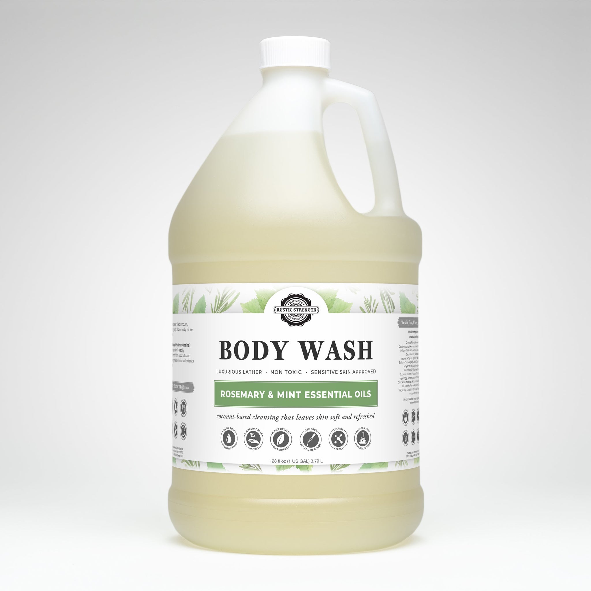 A gallon jug displays Rustic Strength body wash, touting rosemary and mint essential oils for luxurious lather and sensitive skin.
