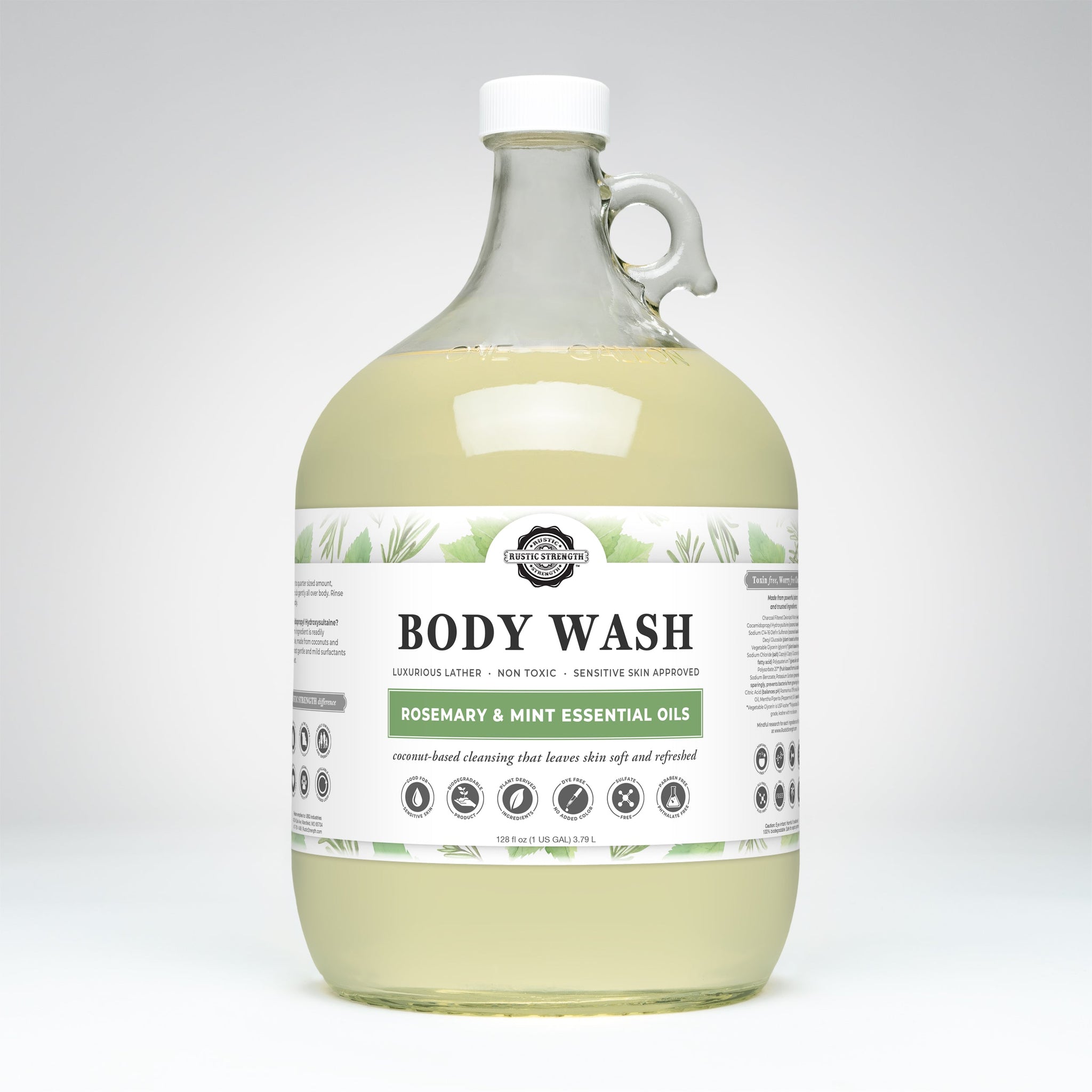 A one-gallon jug displays Rustic Strength rosemary mint essential oil body wash, emphasizing its natural, sensitive skin-friendly formula.
