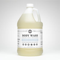 A gallon jug showcases Rustic Strength unscented hypoallergenic body wash, promoting natural coconut-based cleansing for sensitive skin.
