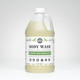 A bottle of Rustic Strength body wash promotes its rosemary and mint essential oils for sensitive skin.