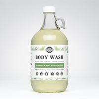 Rustic Strength sells their rosemary mint essential oils body wash in a clear gallon jug.