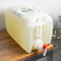 A large container of Rustic Strength Rosemary & Mint body wash sits on a wooden shelf.
