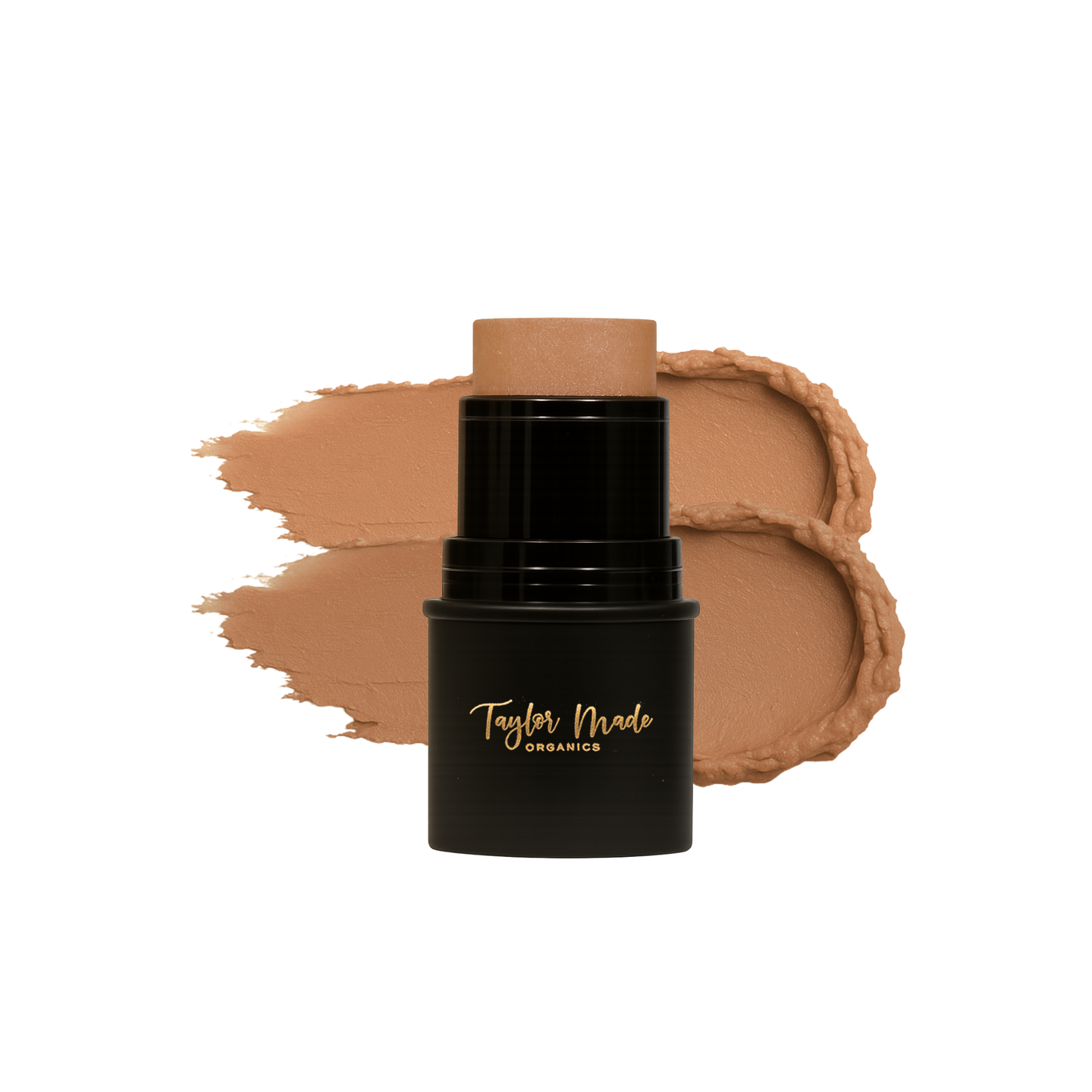 Taylor Made Organics foundation stick sits beside a creamy swatch of its tan formula.
