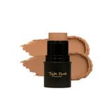 Taylor Made Organics foundation stick sits beside a creamy swatch of its tan formula.
