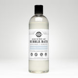 Bottle displays unscented, hypoallergenic Rustic Strength bubble bath safe for mama and baby, made with vitamin B and cucumber extract.
