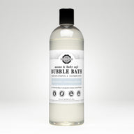 Bottle displays unscented, hypoallergenic Rustic Strength bubble bath safe for mama and baby, made with vitamin B and cucumber extract.
