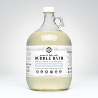 Rustic Strength markets its mama and baby safe, unscented, hypoallergenic bubble bath made with vitamin B and cucumber extract in a one-gallon glass jug.
