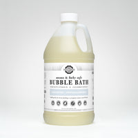 Showcases a large bottle of Rustic Strength Mama & Baby Safe Bubble Bath, highlighting its unscented and hypoallergenic formula made with vitamin B and cucumber extract.
