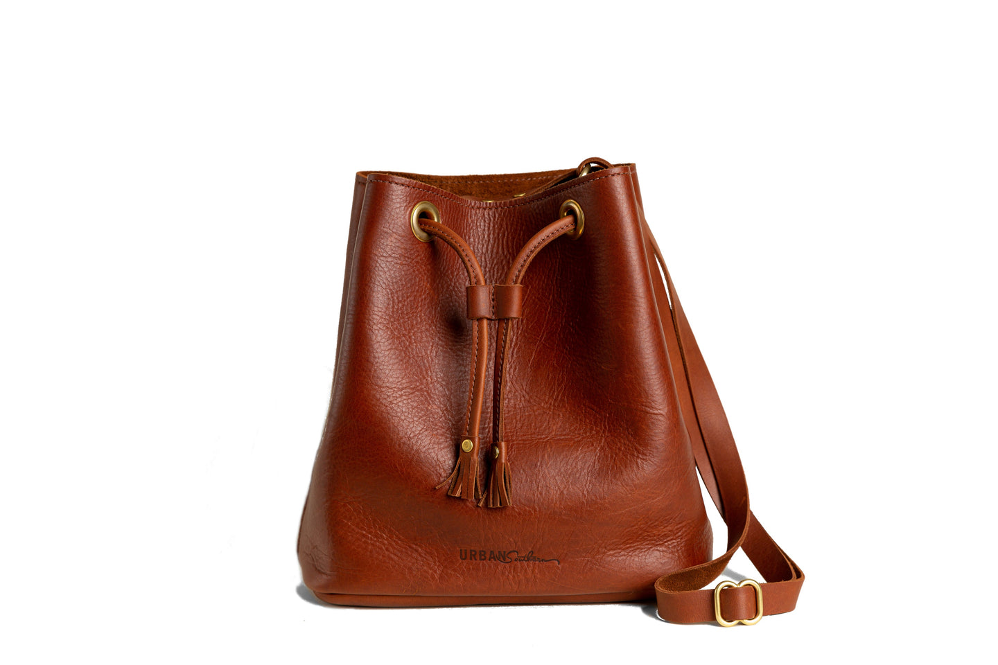 Showcases a luxurious brown leather bucket bag with a drawstring closure and shoulder strap.
