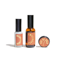 Three Urb Apothecary skincare products, including Willow Cleanser, Sweetgrass, and Pot of Gold, sit on a white background.
