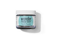 Examine a jar of Wonder Fresh Mint Tooth Powder for natural teeth cleaning and a healthy, eco-friendly dental routine.